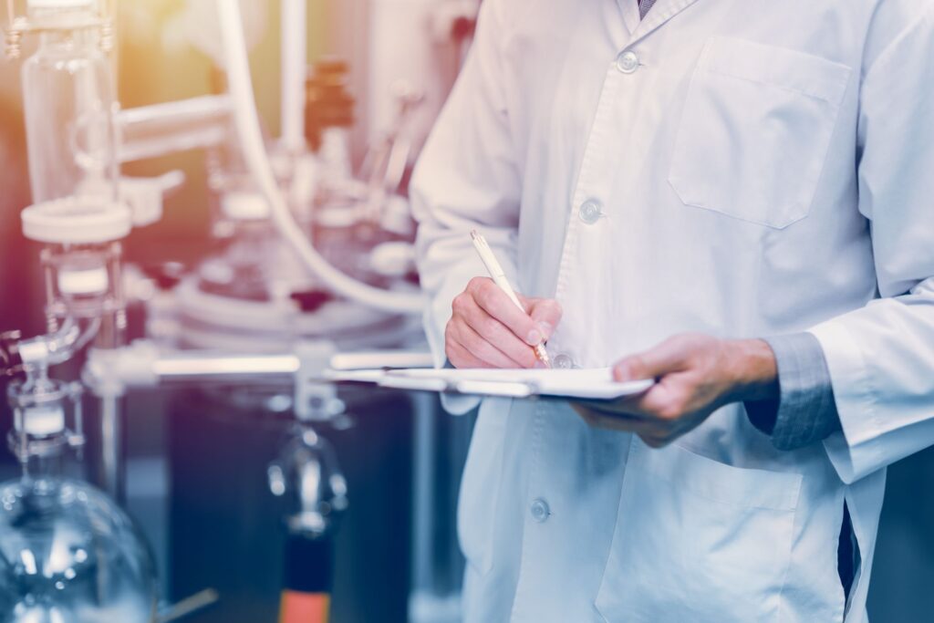 QA professional with clipboard performing SQF Certification process